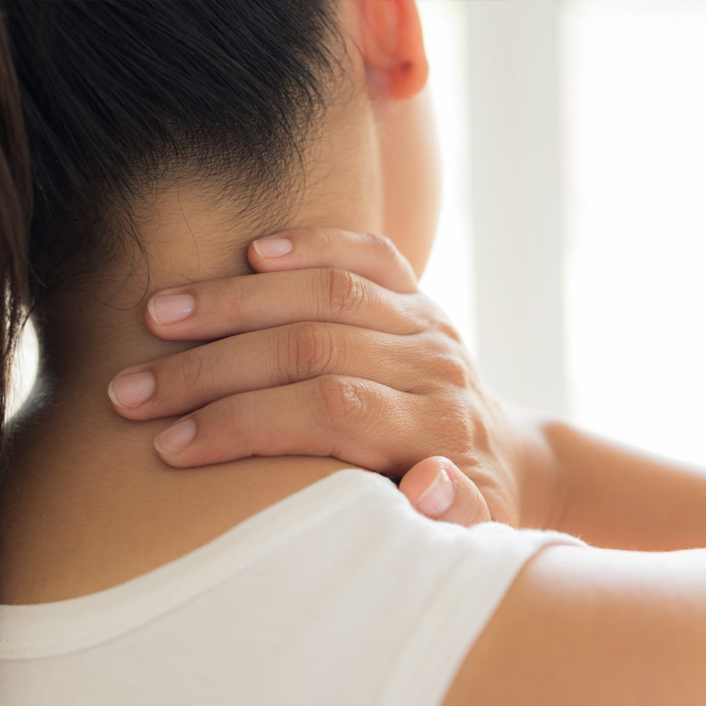 Woman struggling with neck pain