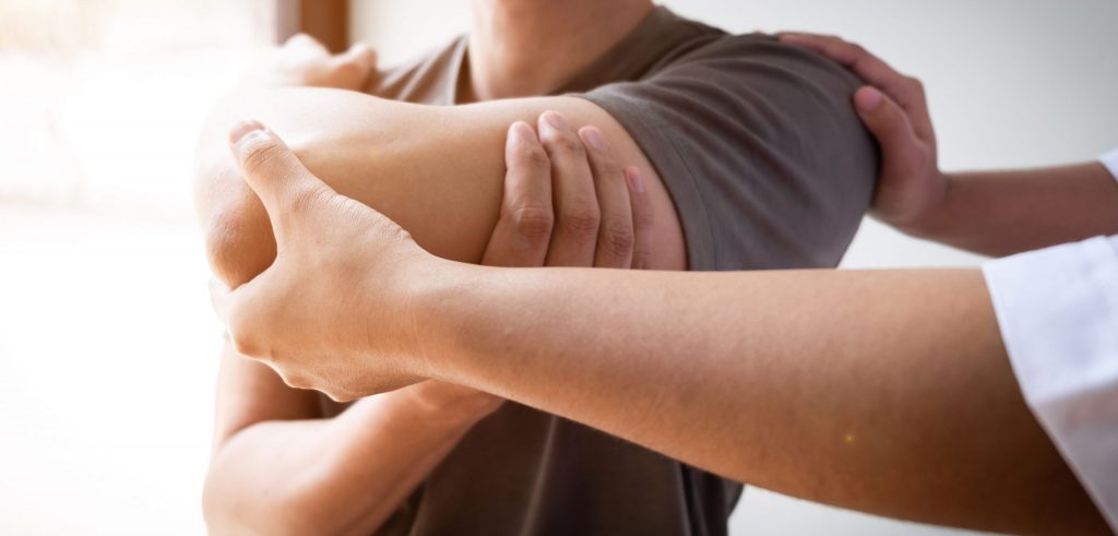 Man receiving treatment for a rotator cuff injury