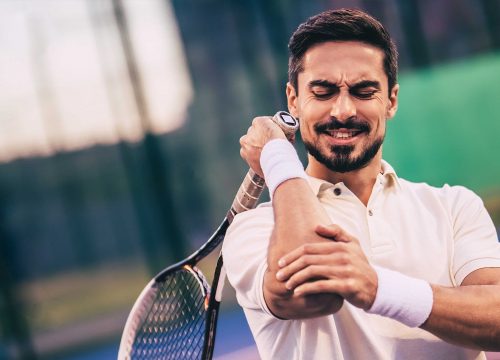 Tennis player injuring his elbow