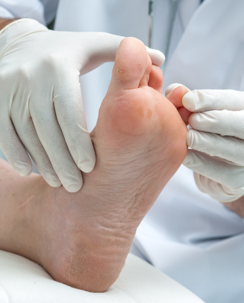 Doctor examining a patient's foot