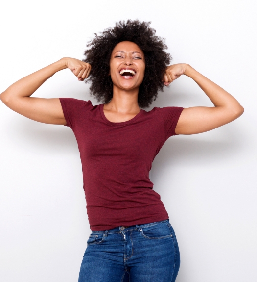 Woman in red shirt flexing her arms.