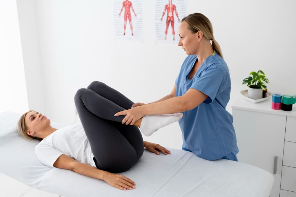 physiotherapist-stretching-patient-leg-in-clinic