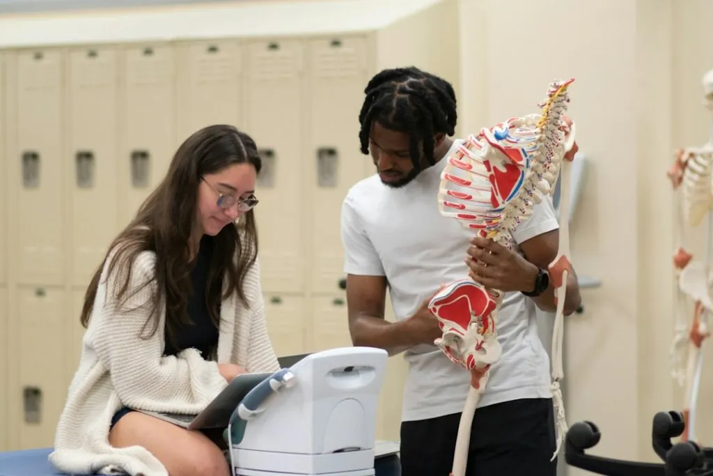 Clinician explaining a spine model to a patient