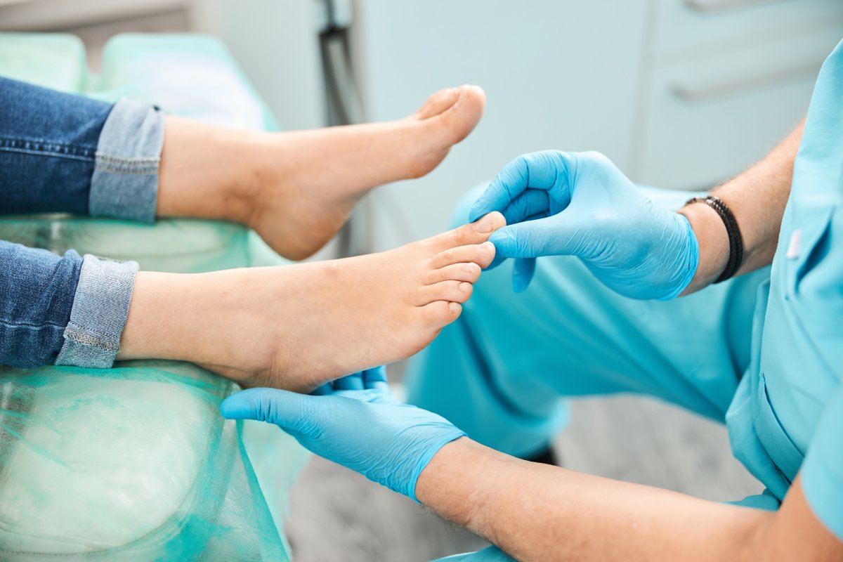 Doctor examining a patient's foot