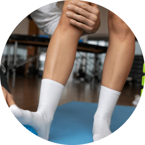 Physical therapist helping patient with rehabilitation at Global Pain & Spine Clinic