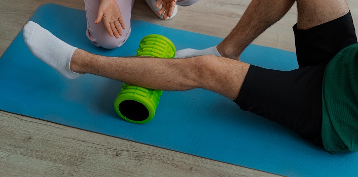 doctor-helping-patient-rehabilitation 1 (1)