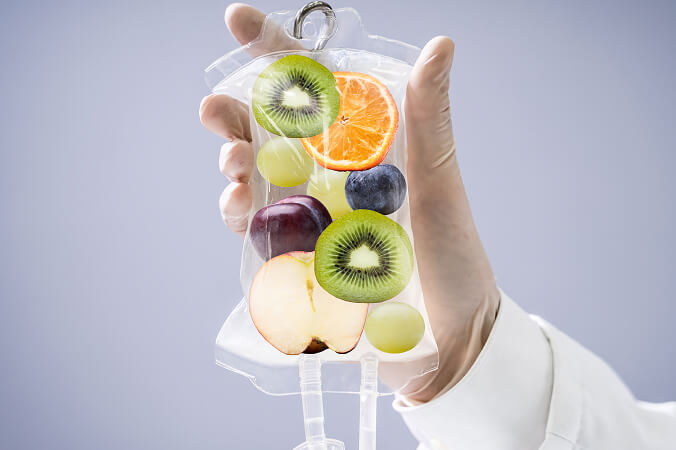 doctor-holding-saline-bag-with-fruit-slices-inside-hospital 1 (1)