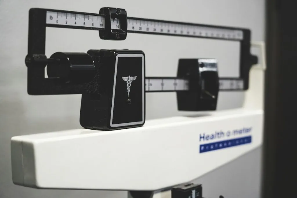 Close-up of a medical balance beam scale used to measure body weight