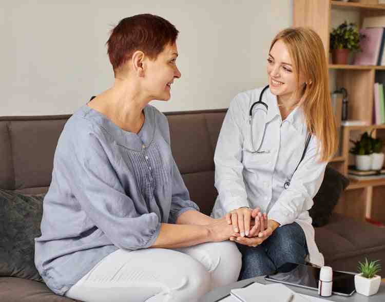 interventional pain management specialist consulting with patient