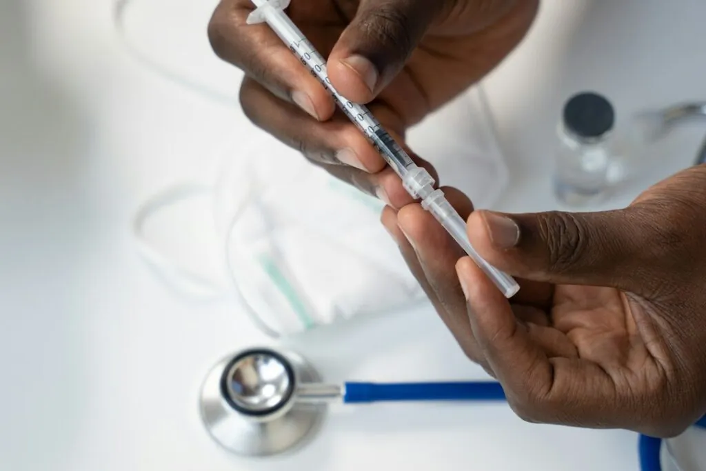 clinician preparing an intramuscular injection in a modern clinic