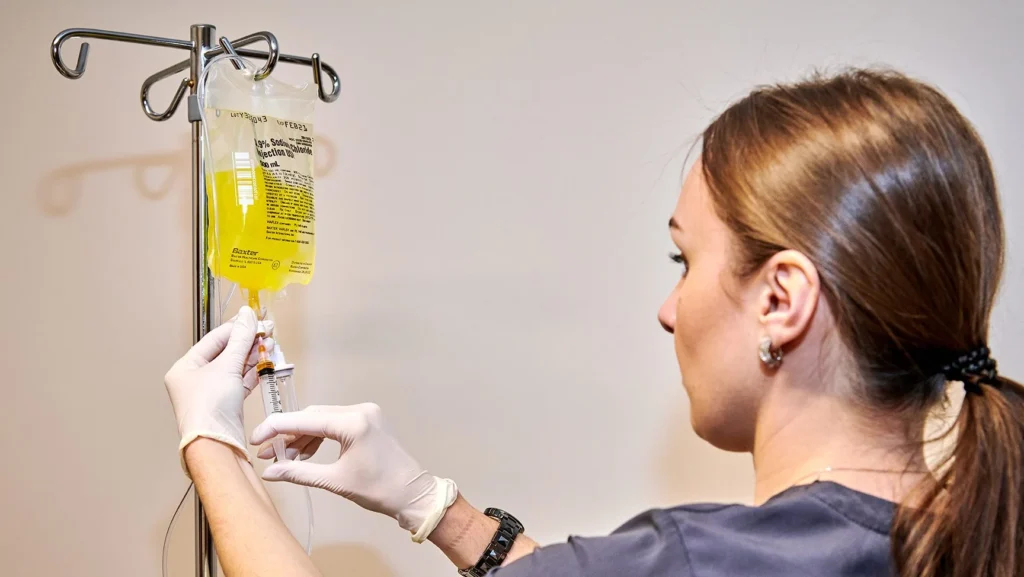 clinician preparing a specialized B-vitamin infusion